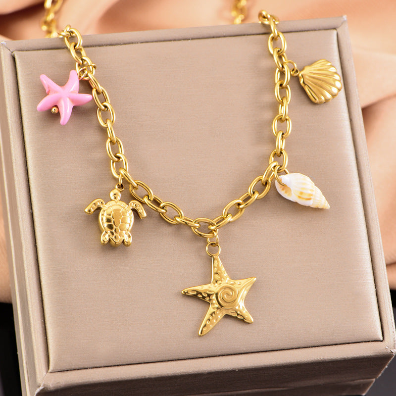 Collier en or étoile de mer tortue conque