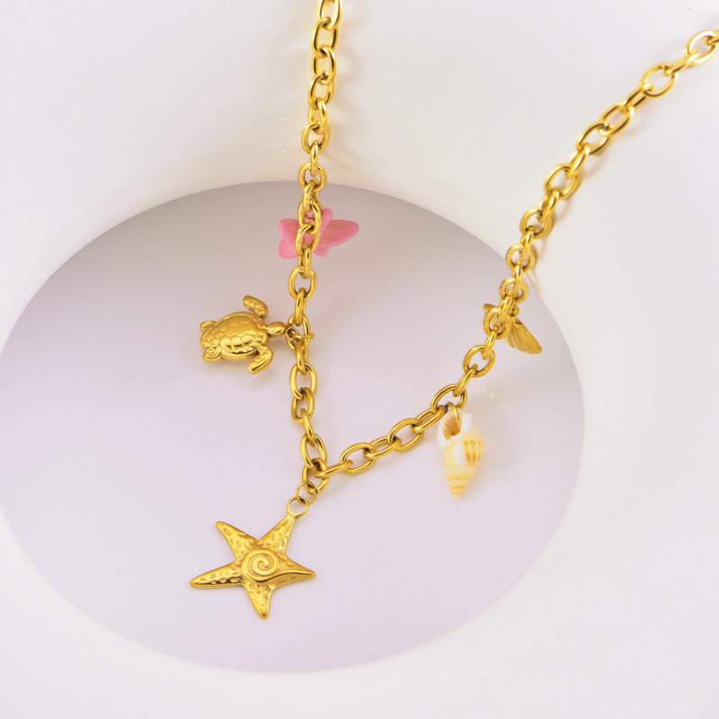 Collier en or étoile de mer tortue conque