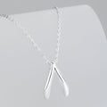 Collier en argent sterling avec pendentif en forme d'os de la chance