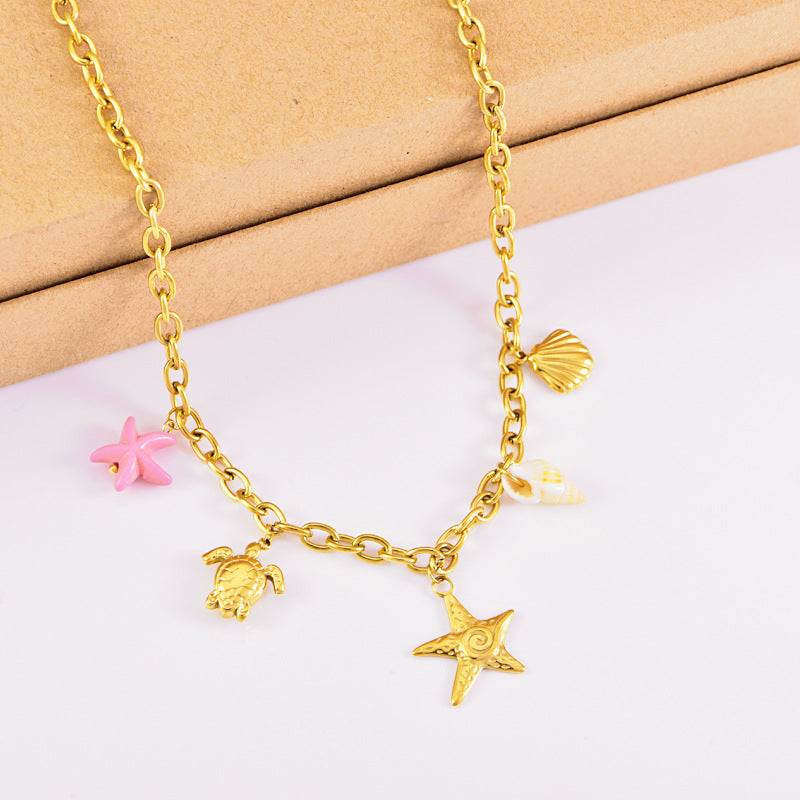 Collier en or étoile de mer tortue conque