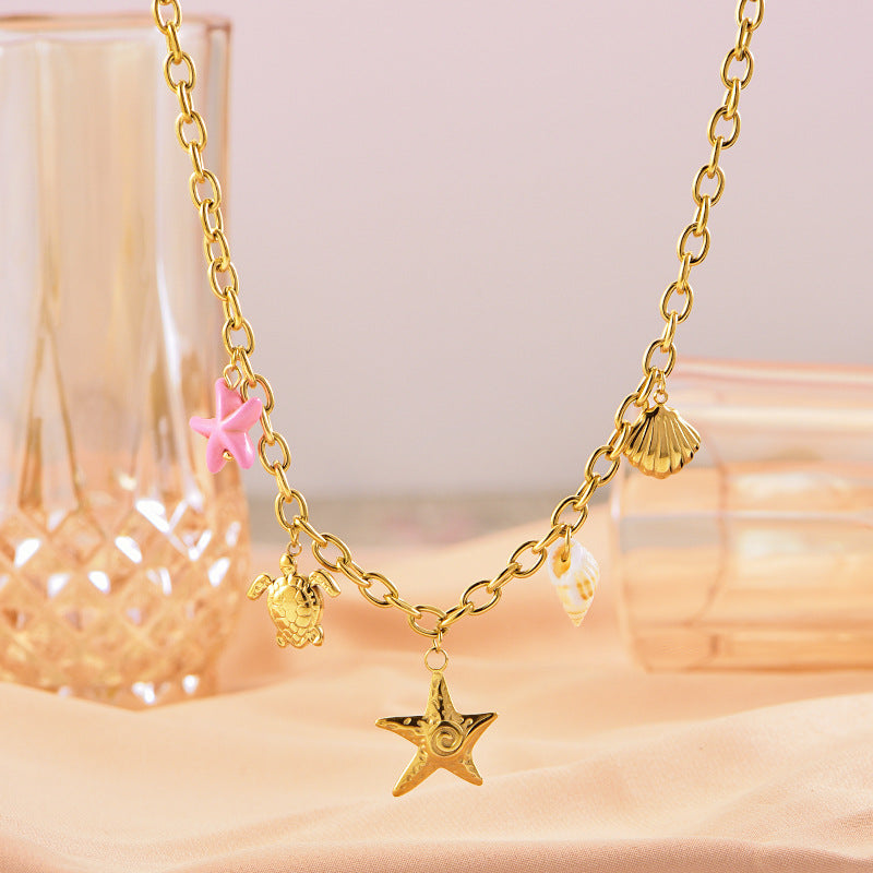 Collier en or étoile de mer tortue conque
