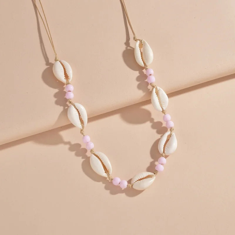 Ras du cou tressé avec perles de coquillages