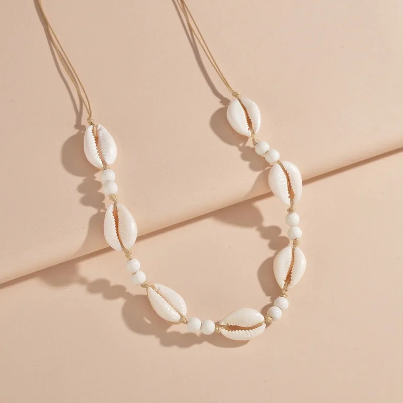Ras du cou tressé avec perles de coquillages