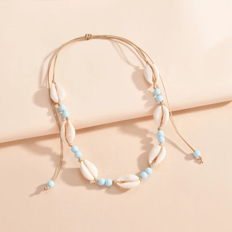 Ras du cou tressé avec perles de coquillages